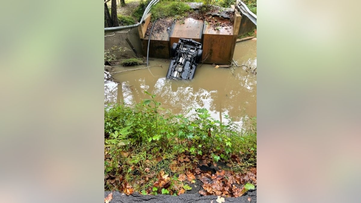 Paxson's Jeep overturned in a body of water below the Snow Creek Bridge