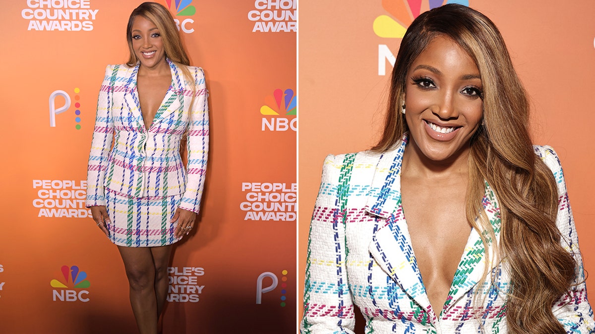 Mickey Guyton wears white plaid blazer with blue and purple stripes