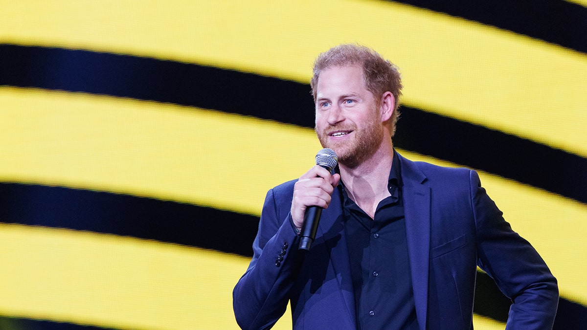 Prince Harry onstage with microphone