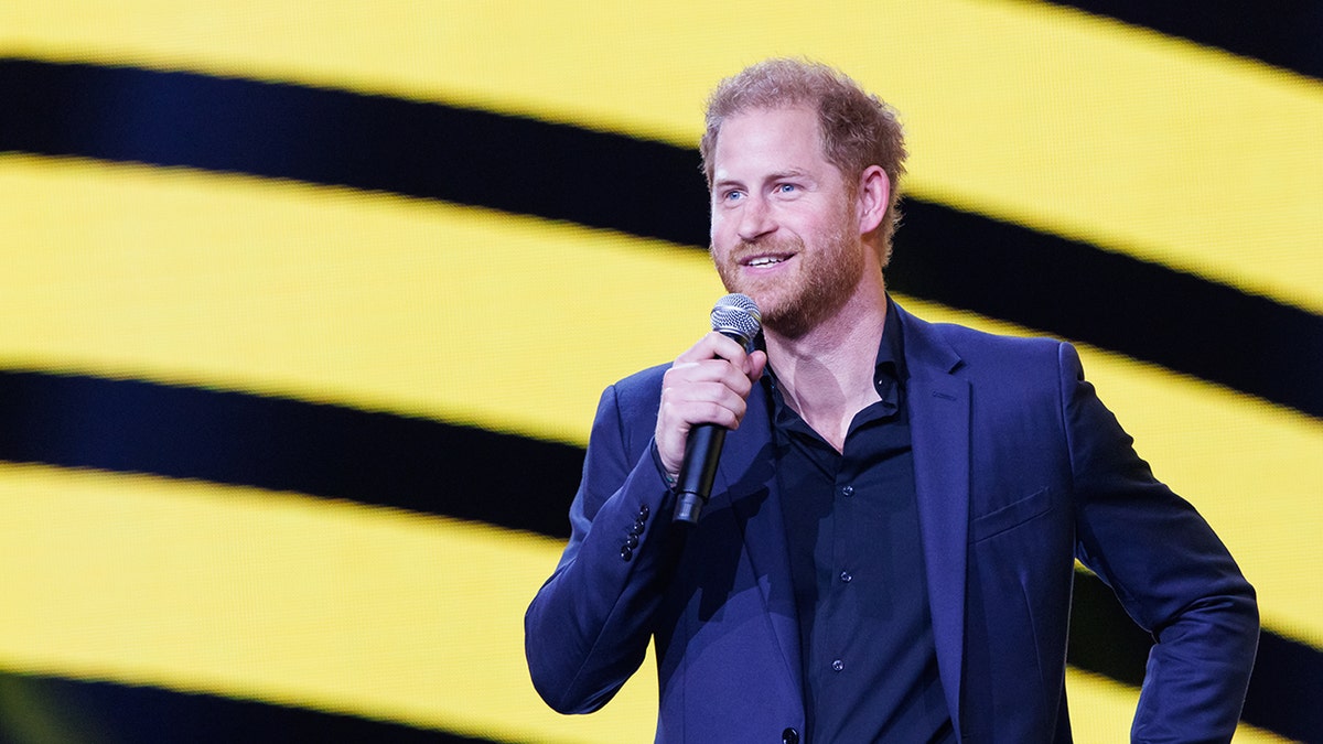 Prince Harry onstage with microphone