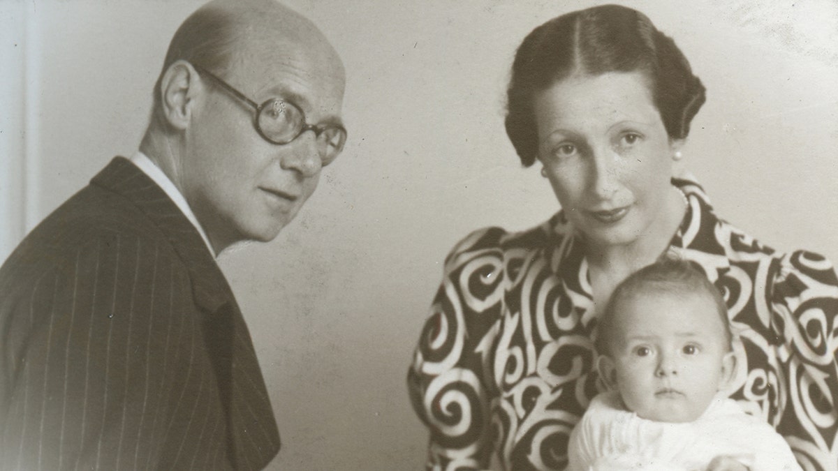 Prince Michael of Greece as a baby with his parents in a portrait
