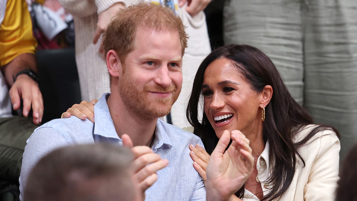 Prince Harry, Meghan Markle pack on PDA as they celebrate duke's 