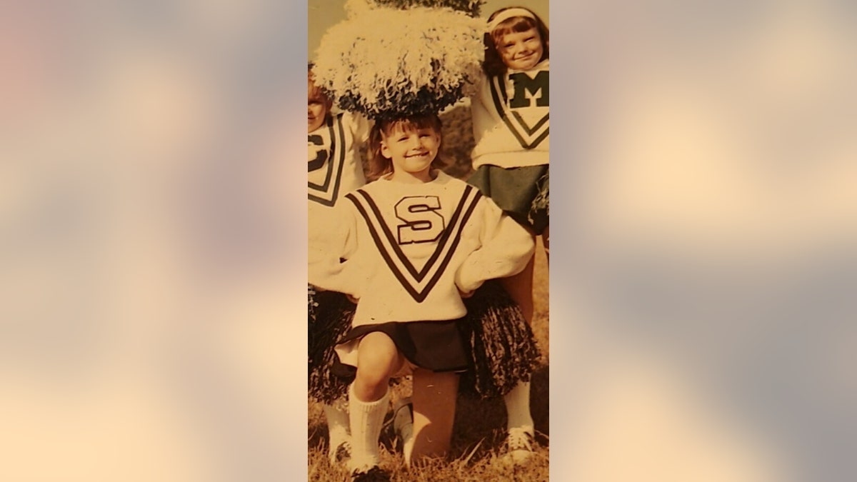 Debbie Lynn Randall in a cheerleading uniform