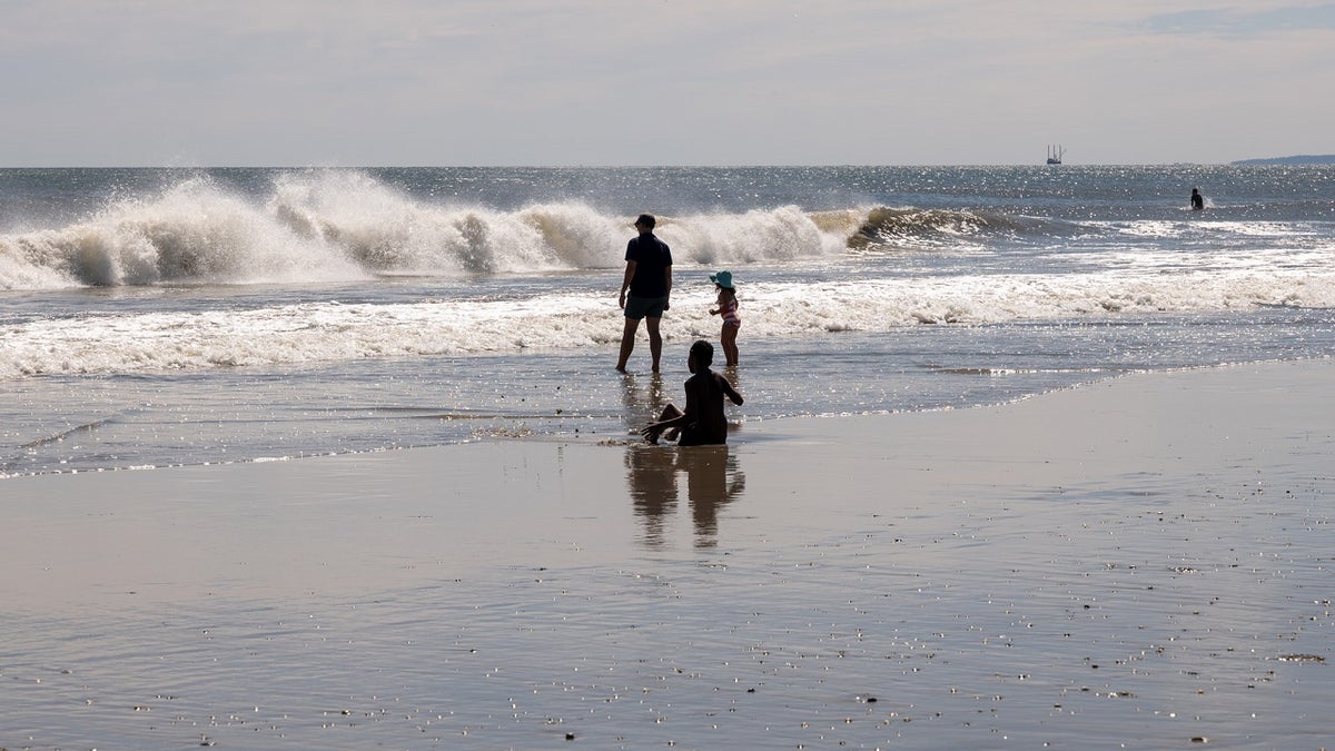 Waves crash into Rockaway Beach in New York City