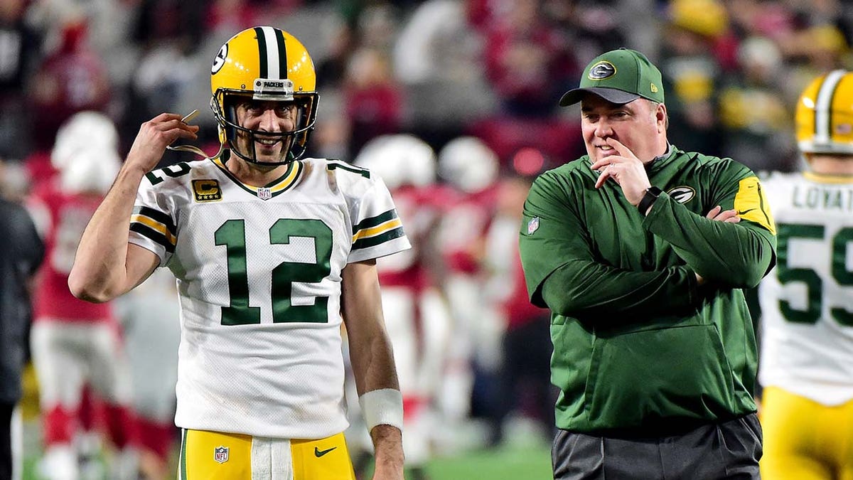 Aaron Rodgers talks with Mike McCarthy