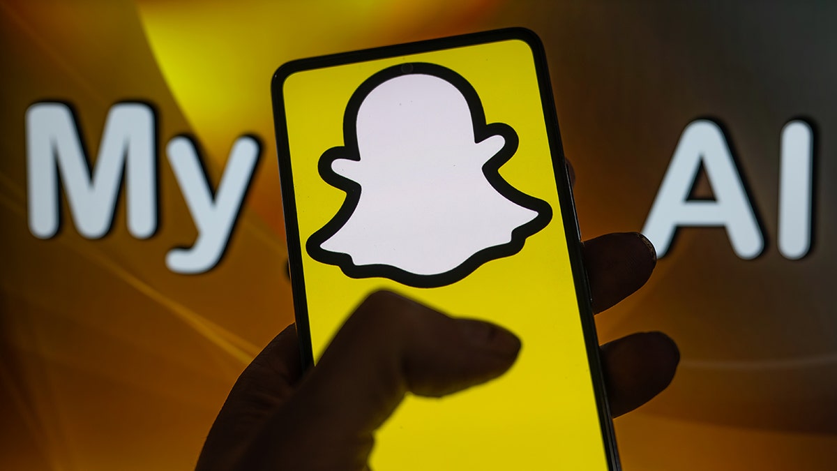 Snapchat AI logo on cell phone