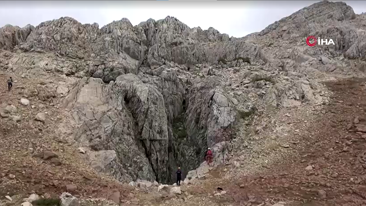 The cave, surrounding area, dirt