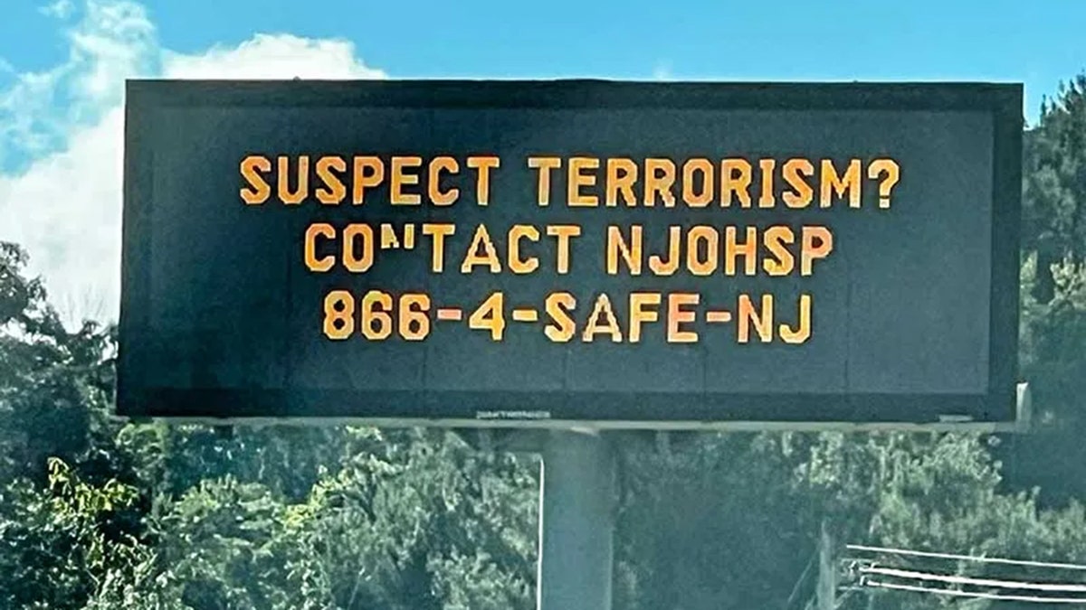 New Jersey highway sign reads "Suspect Terrorism? Contact NJOHSP 866-4-SAFE-NJ