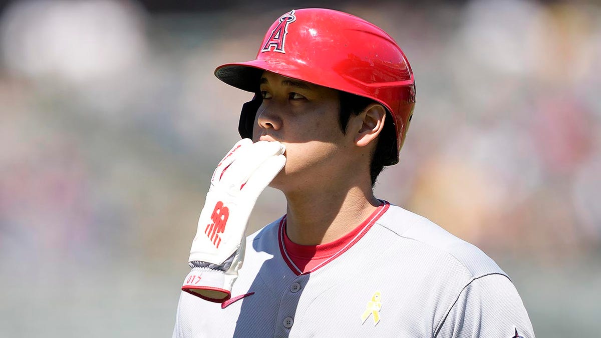 Shohei Ohtani has glove in mouth