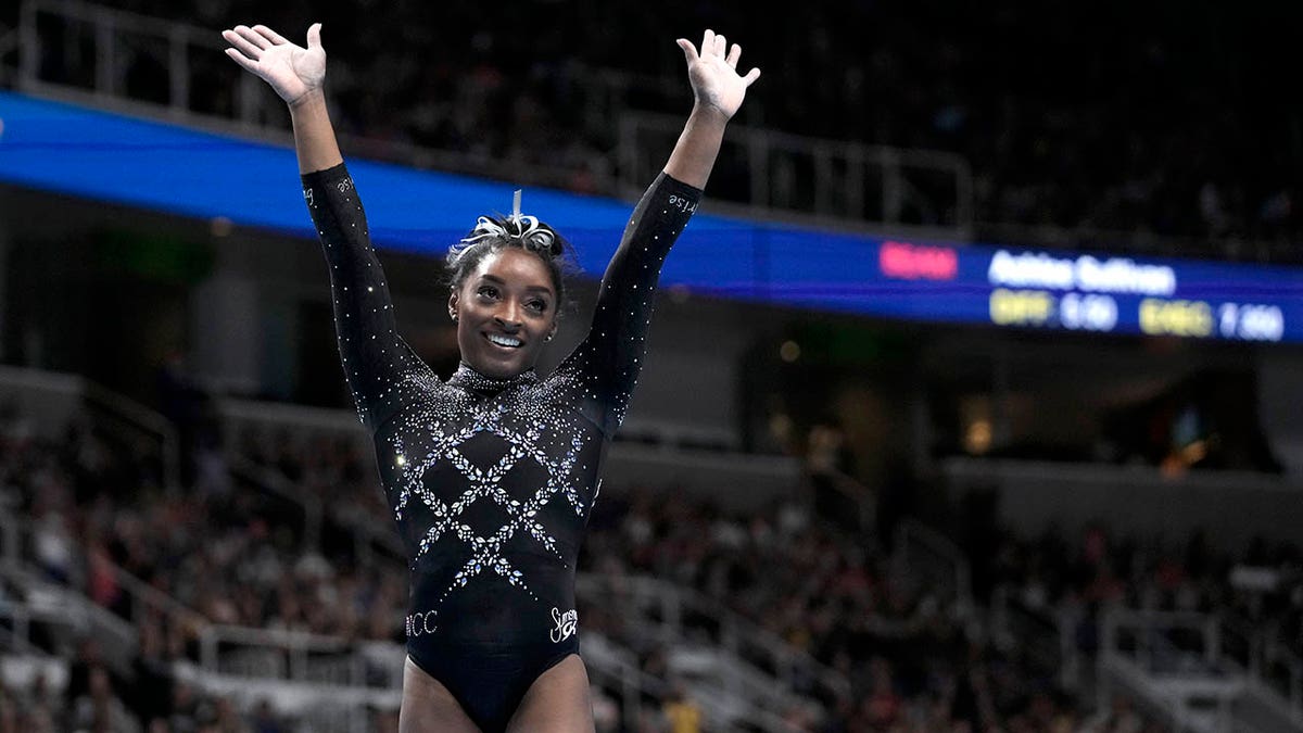 Simone Biles waves to the crowd