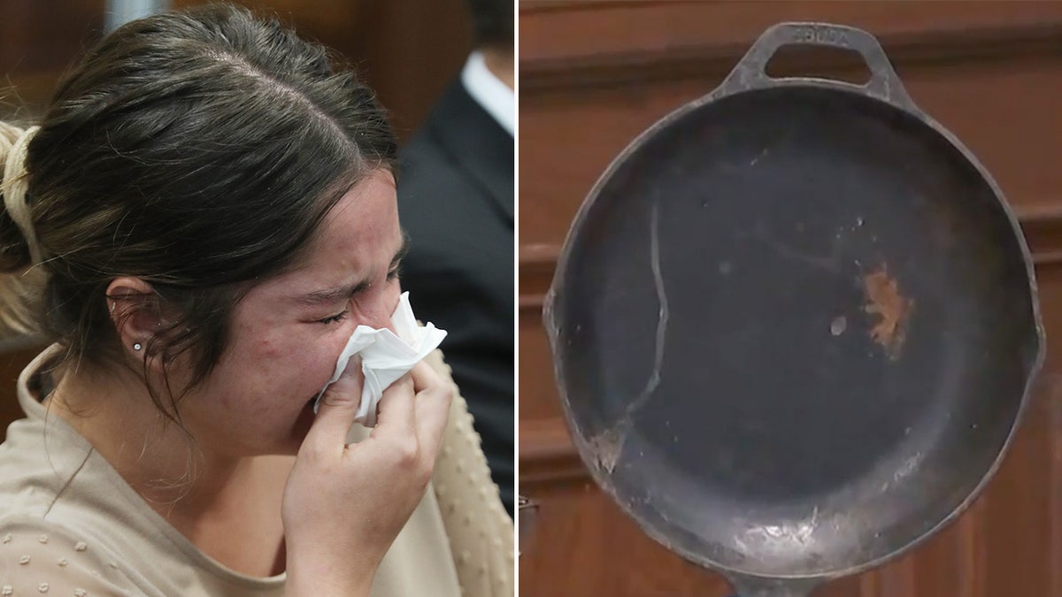 Woman sobs at the defense table next to a photo of the murder weapon.