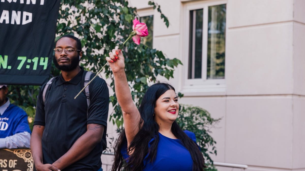 Terrisa Bukovinac holding a rose