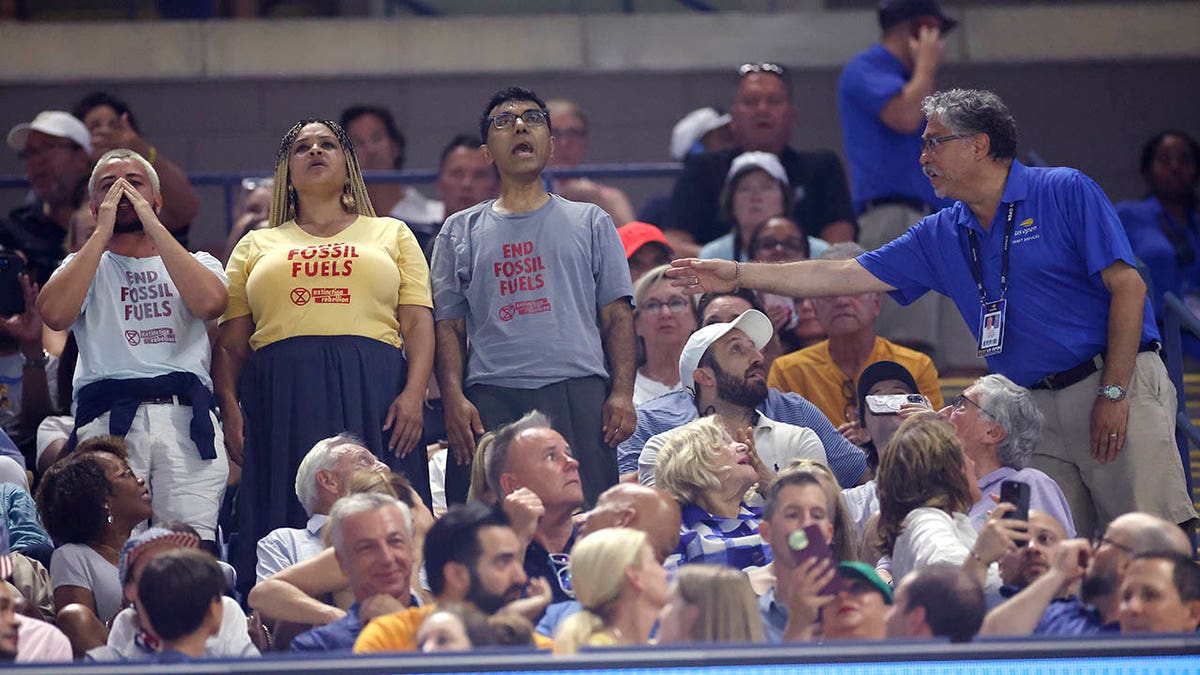 Protesters yell at the US Open