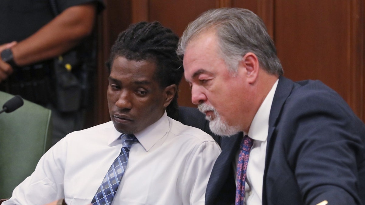 DeShawn Stafford talks with his defense attorney Jon Sinn before hearing being found guilty of aggravated assault and assault in Summit County Common Pleas Judge Tammy O'Brien courtroom.