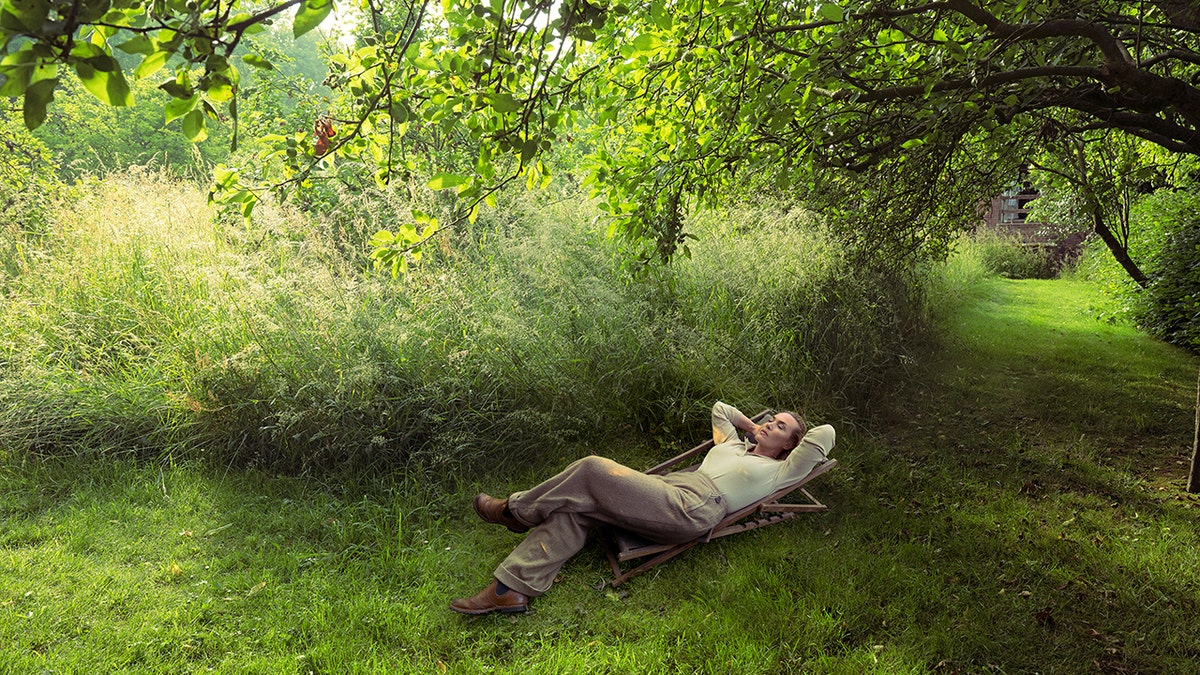 A photo of Kate Winslet lying in the grass