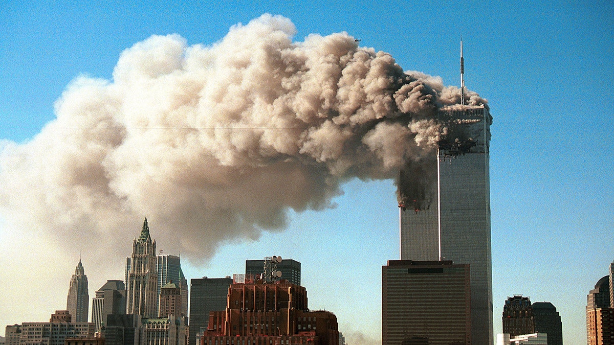 World Trade Center towers with smoke billowing on 9/11