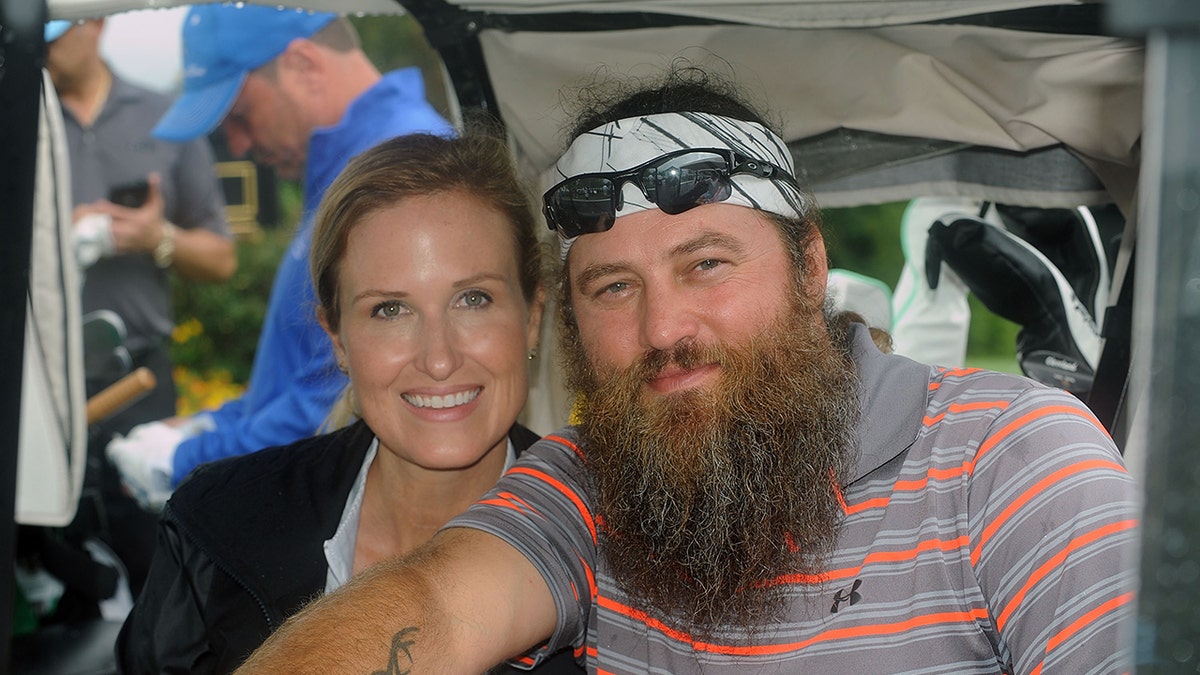 Korie Robertson and Willie Robertson smiling together