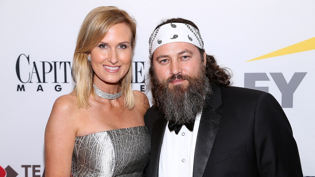 Korie Robertson and Willie Robertson posing together