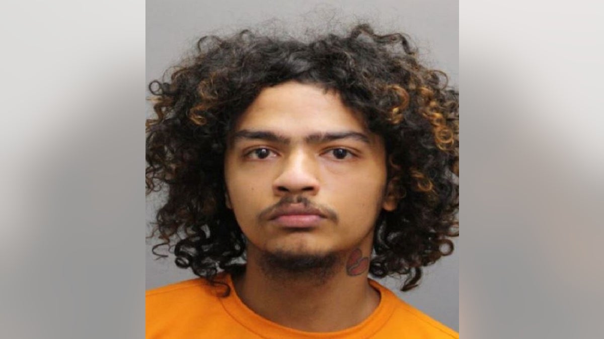 A mugshot of Yadiel Gonzalez with his orange Popeyes T-shirt