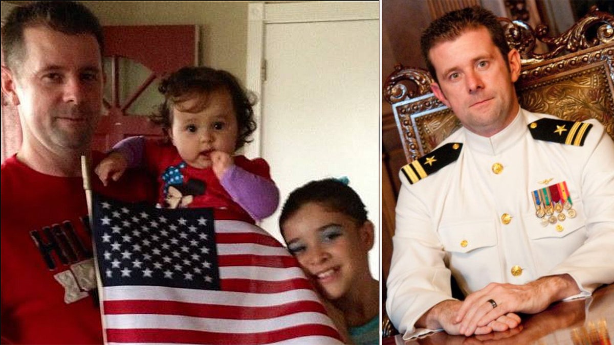 Ron Youngblood poses with an American flag and his daughter next to a photo of him in his Navy uniform.