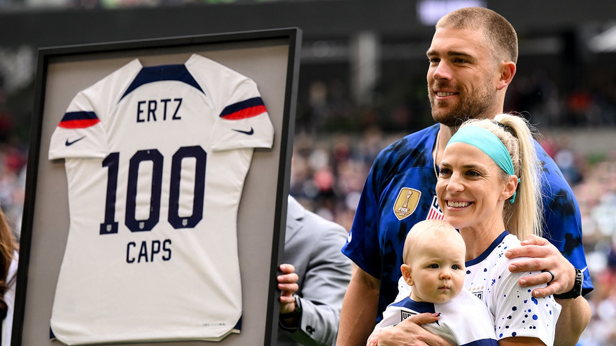 Julie and Zach Ertz pose for picture with son, Madden