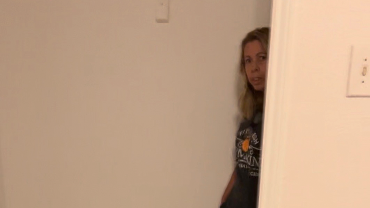 alleged Texas Squatter peeking out of closet