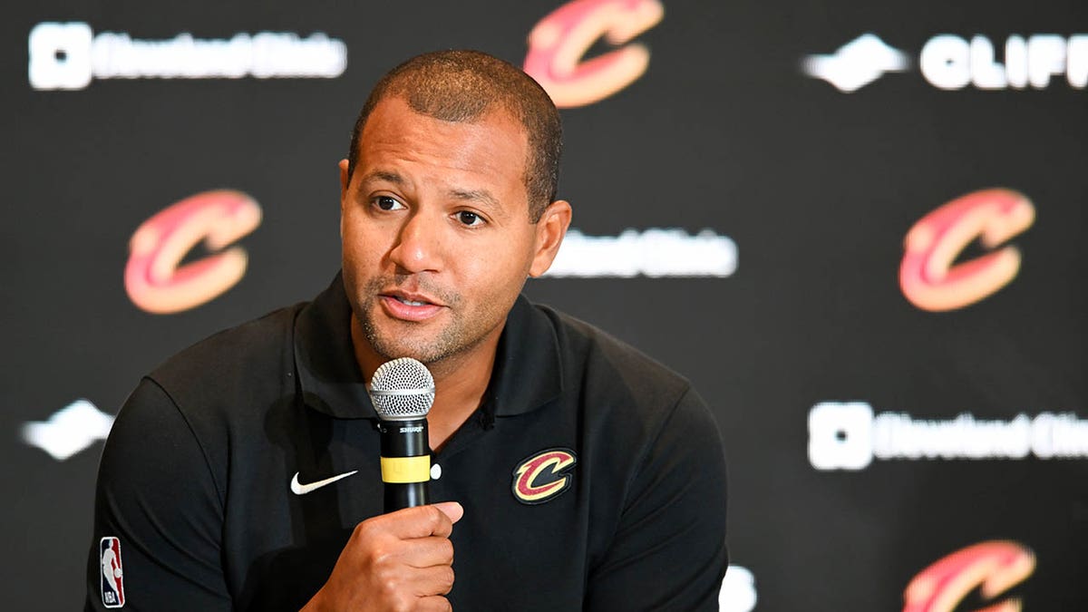 Koby Altman speaks during a press conference