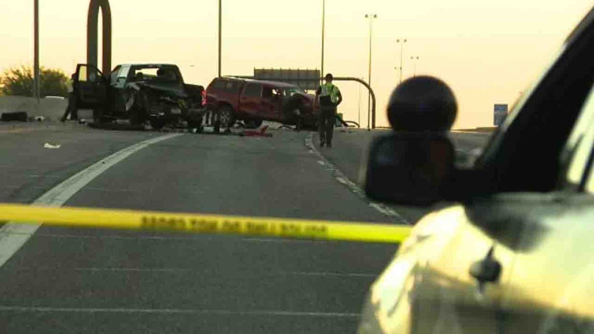 troopers and vehicles at crash scene