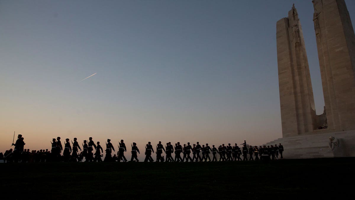 french WWI memorial with soldiers marching