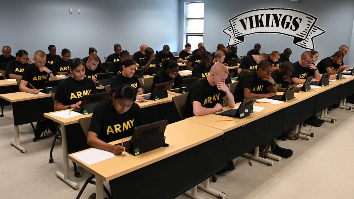 Army recruits at desks in training