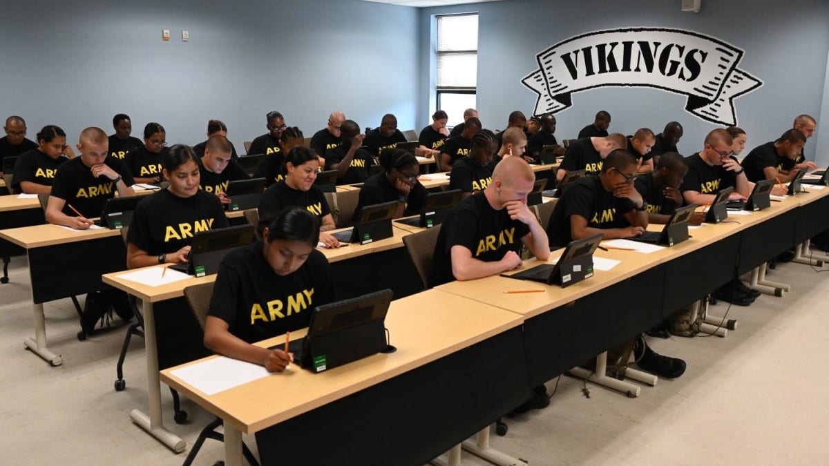 Army recruits at desks in training