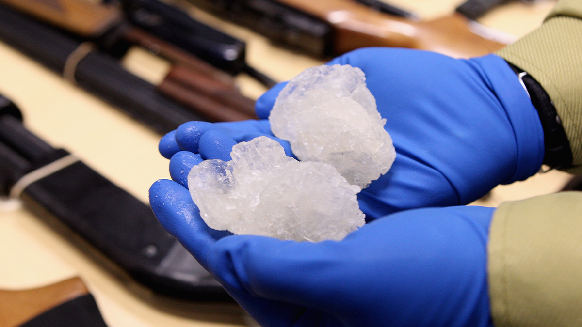 crystal meth rocks held in gloved hands
