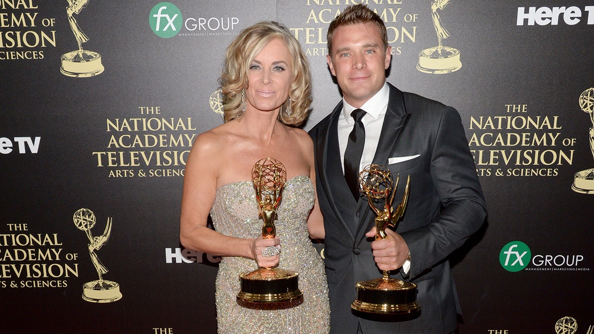 Billy Miller and Eileen Davidson hold Emmy awards at 2014 ceremony