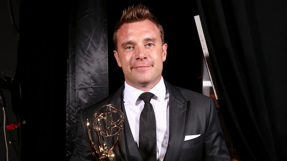 General Hospital star Billy Miller poses with Emmy Awards
