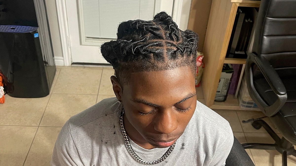 Darryl's mom took a picture of his hairdo following suspension