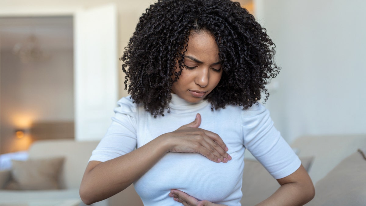 woman self breast exam