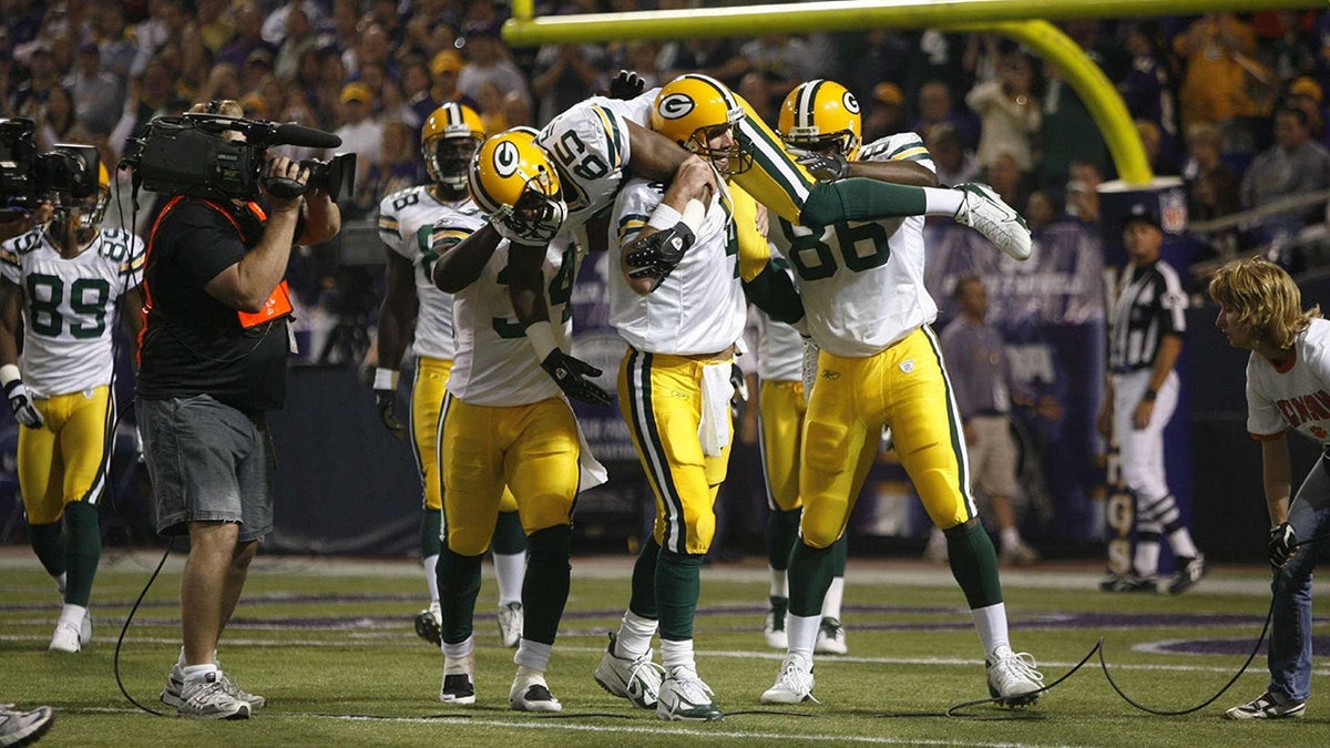 Brett Favre celebrates breaking Dan Marino record