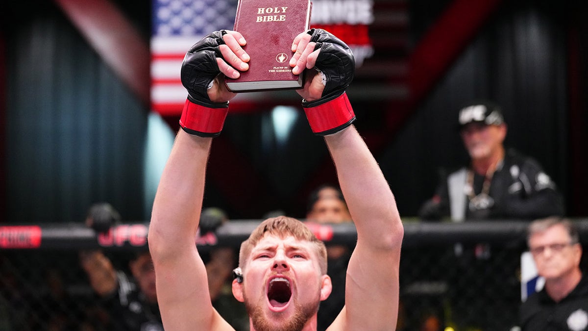 Bryce Mitchell with bible