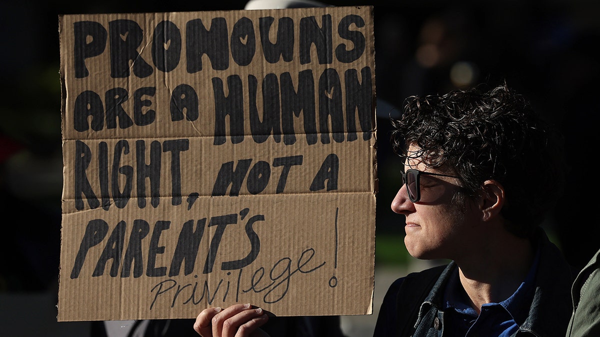 A counter protester supports transgender children