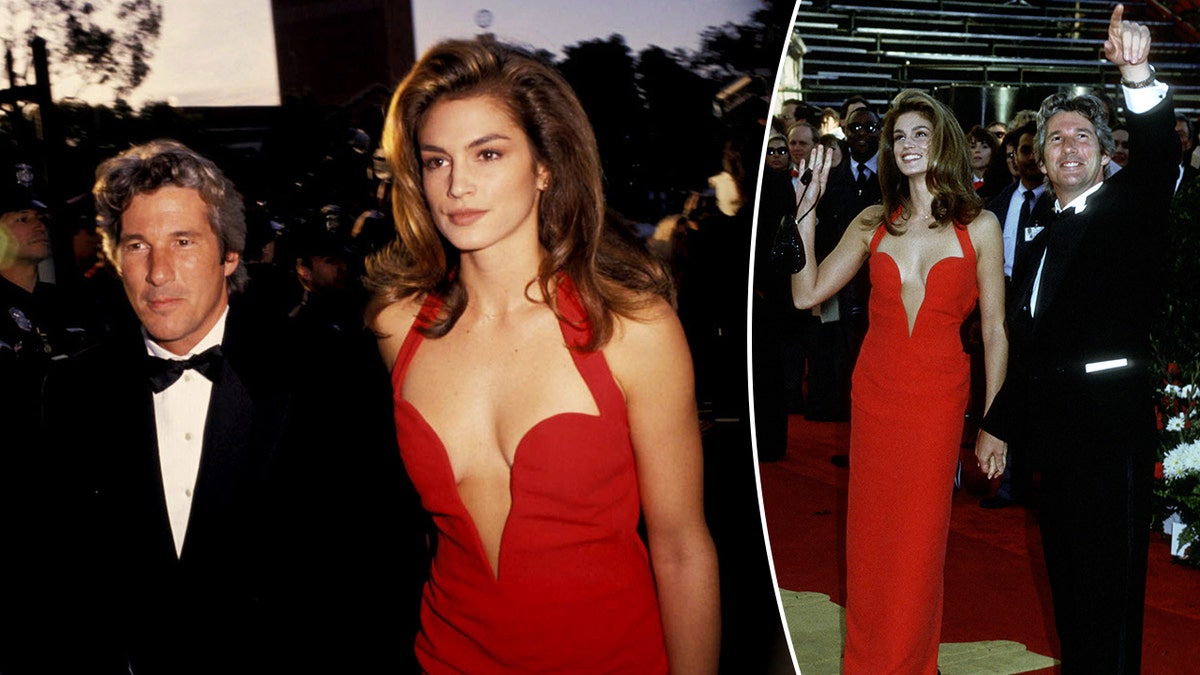Cindy Crawford in a plunging red Versace dress walks with Richard Gere in a tuxedo split they both wave to people and look up upon arrival at the Oscars in 1991