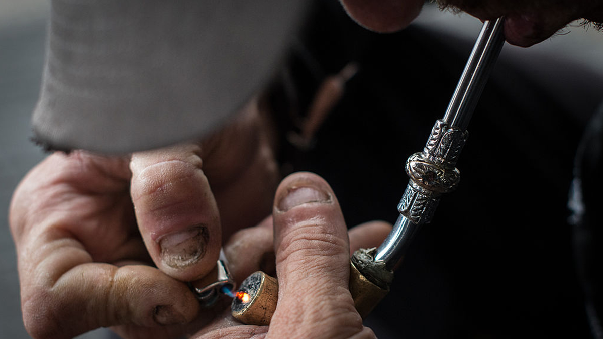 A drug addict lights an improvised pipe