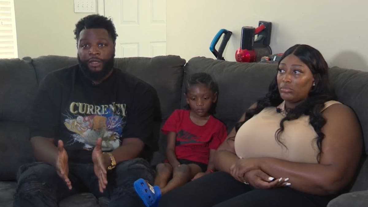 Jordan Denton, child victim and Samerramise Gibson on couch 