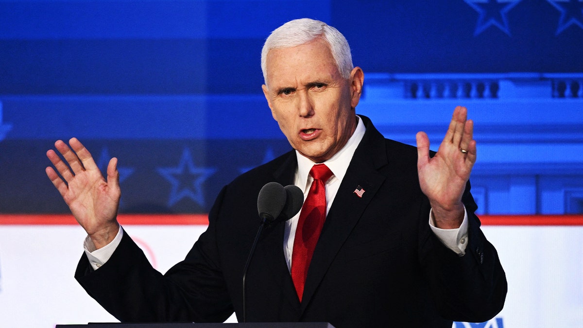 Former Vice President Mike Pence stands on debate stage