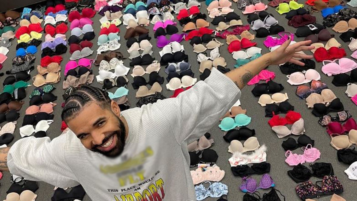 Drake standing in front of hundreds of bras