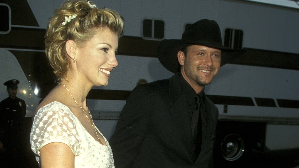 Tim McGraw with a pregnant Faith Hill