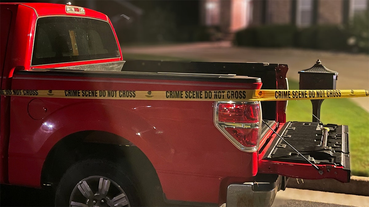 A red Ford truck found at the crime scene