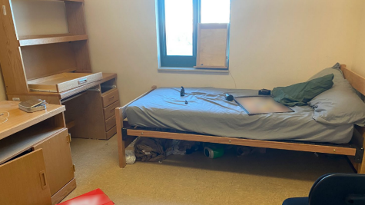 Military barracks bedroom with squatter's possessions