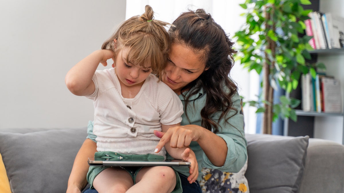 child with down syndrome and parent