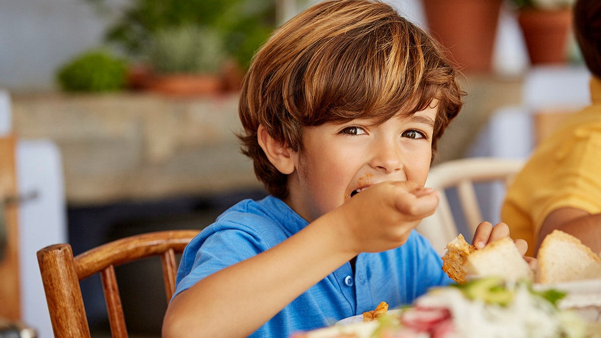 boy eating dinner