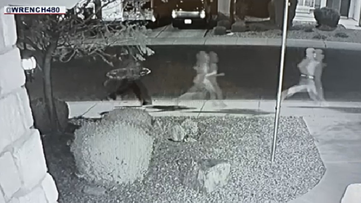 Suspects are seen running on camera in front of John's home